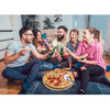 Group of friends enjoying pizza and drinks on a couch in a living room.
