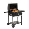 Royal Gourmet Black barbecue grill with food on a white background
