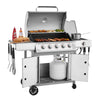 A stainless steel 6-burn outdoor Royal Gourmet gas grill on a wheeled cart, shown with the lid open, food cooking on the grates, a pot on the side burner, and accessories hanging from the side handle. A white propane tank is stored underneath, set against a plain white background.