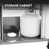 A white LP gas cylinder stored inside a gray metal under-cabinet cabinet, with text reading 'STORAGE CABINET' and a circular inset showing the cabinet floor opening.