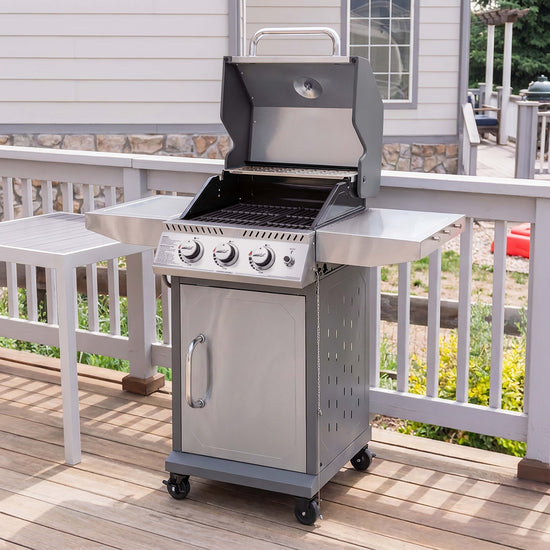 Stainless steel Royal Gourmet grill on a wooden deck with a house in the background