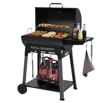 Black Royal Gourmet grill with food, tools, and drinks on a white background