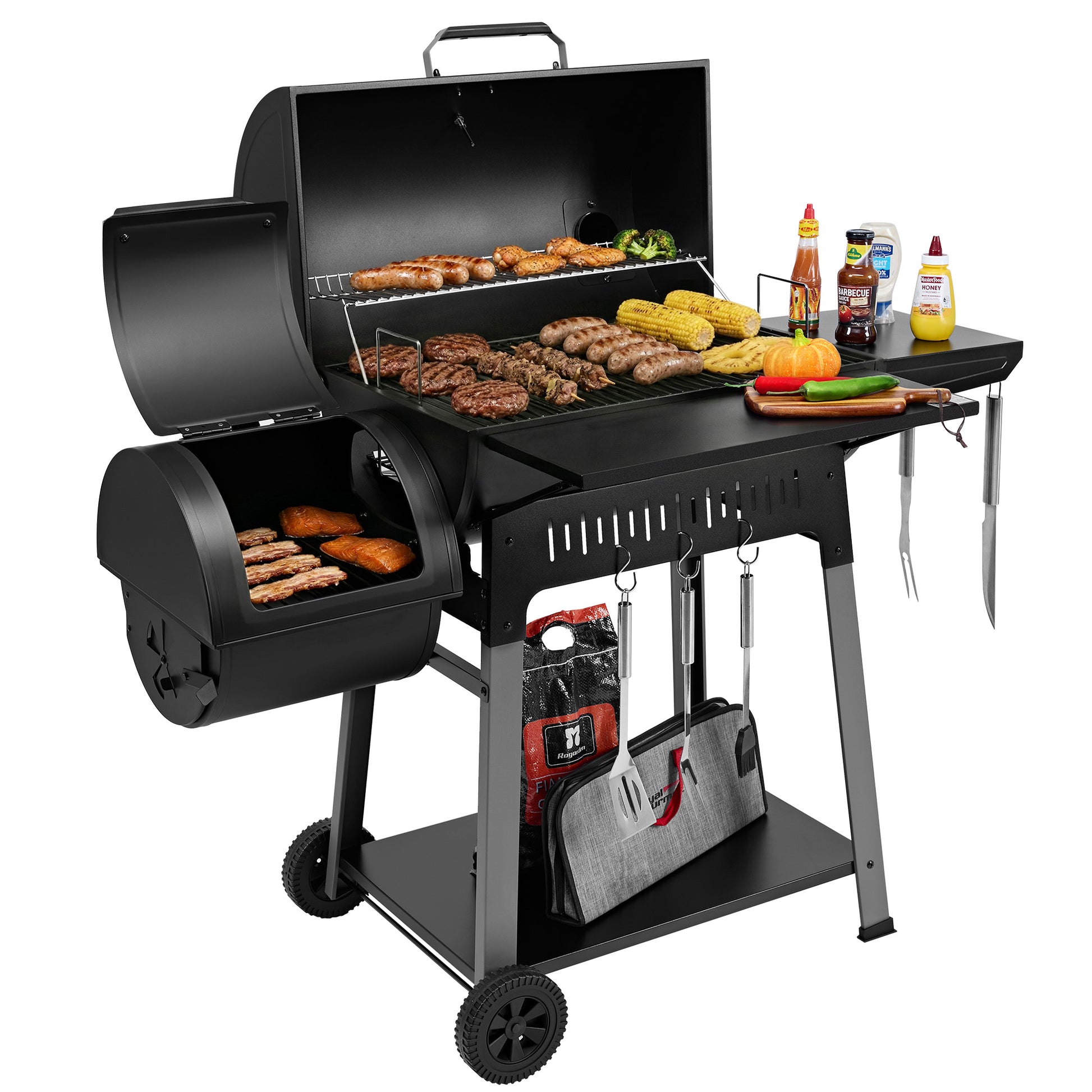 Royal Gourmet Black barbecue grill with food and accessories on a white background