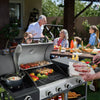 Royal Gourmet Family gathered around a barbecue grill on a patio