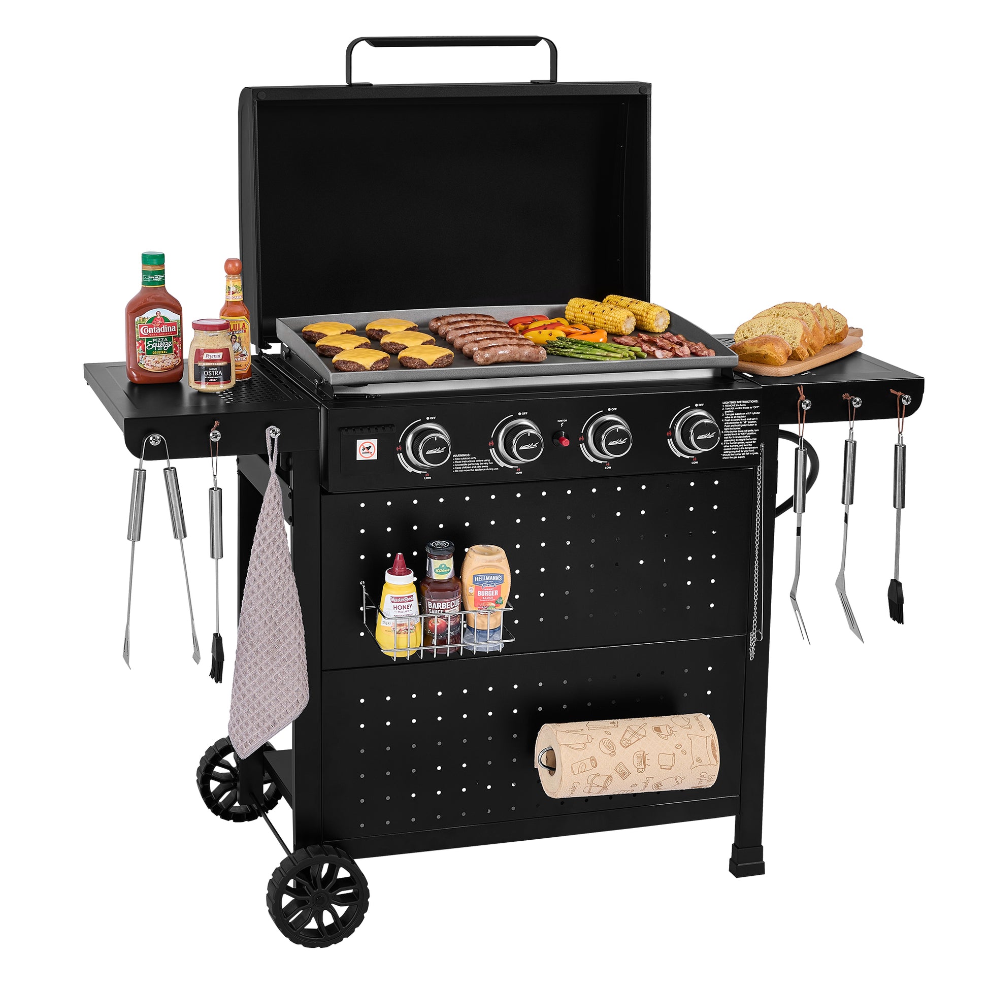 A black 4-burner Royal Gourmet gas grill with side tables, wheels, and hanging utensils, shown with food cooking on the grates and condiments on a white background.