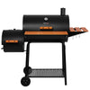 A black Royal Gourmet pellet smoker grill with a side burner, wheeled stand, orange-brown wooden shelf accents, and a small hanging rack, shown on a plain white background.